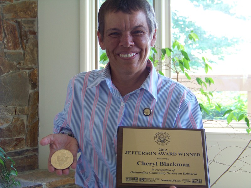 Cheryl Blackman displays her plaque and medal for winning the Jefferson Award. Blackman will be going to Washington, D.C., June 18-20 for the national Jefferson Awards, where she is nominated for the Jacqueline Kennedy Onassis Award for Outstanding Public Service Benefiting the Local Community. BY RYAN MAVITY